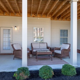 a house with a patio and chairs