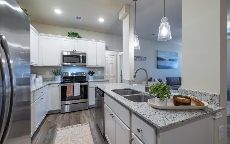 a kitchen with white cabinets