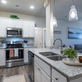 a kitchen with white cabinets