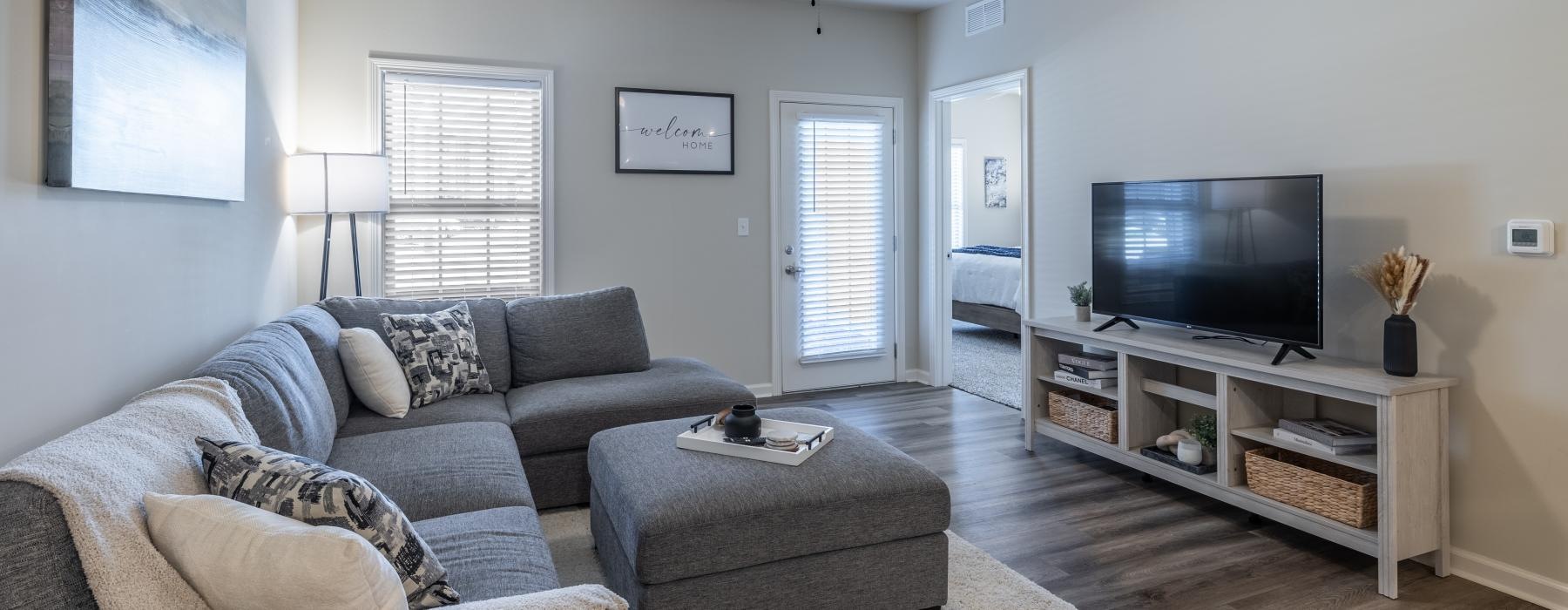 a living room with a tv and couches