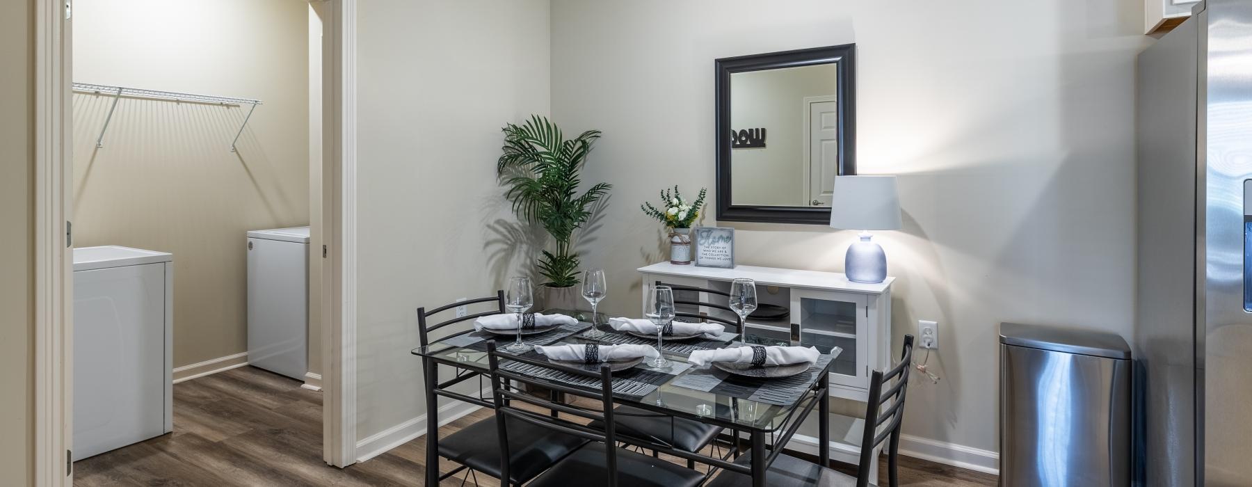 a dining room table with a plant on it